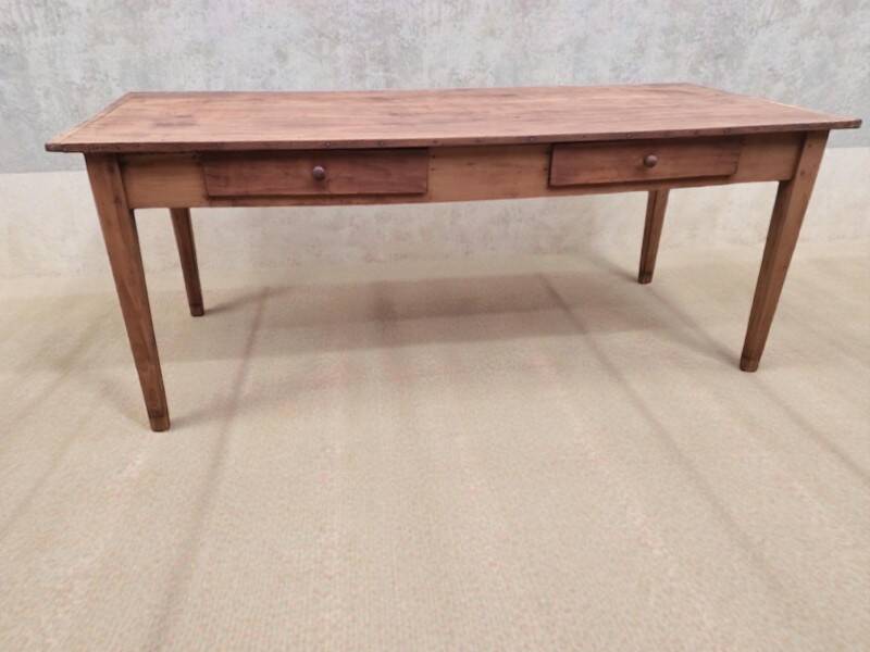 Old farmhouse table with two drawers.