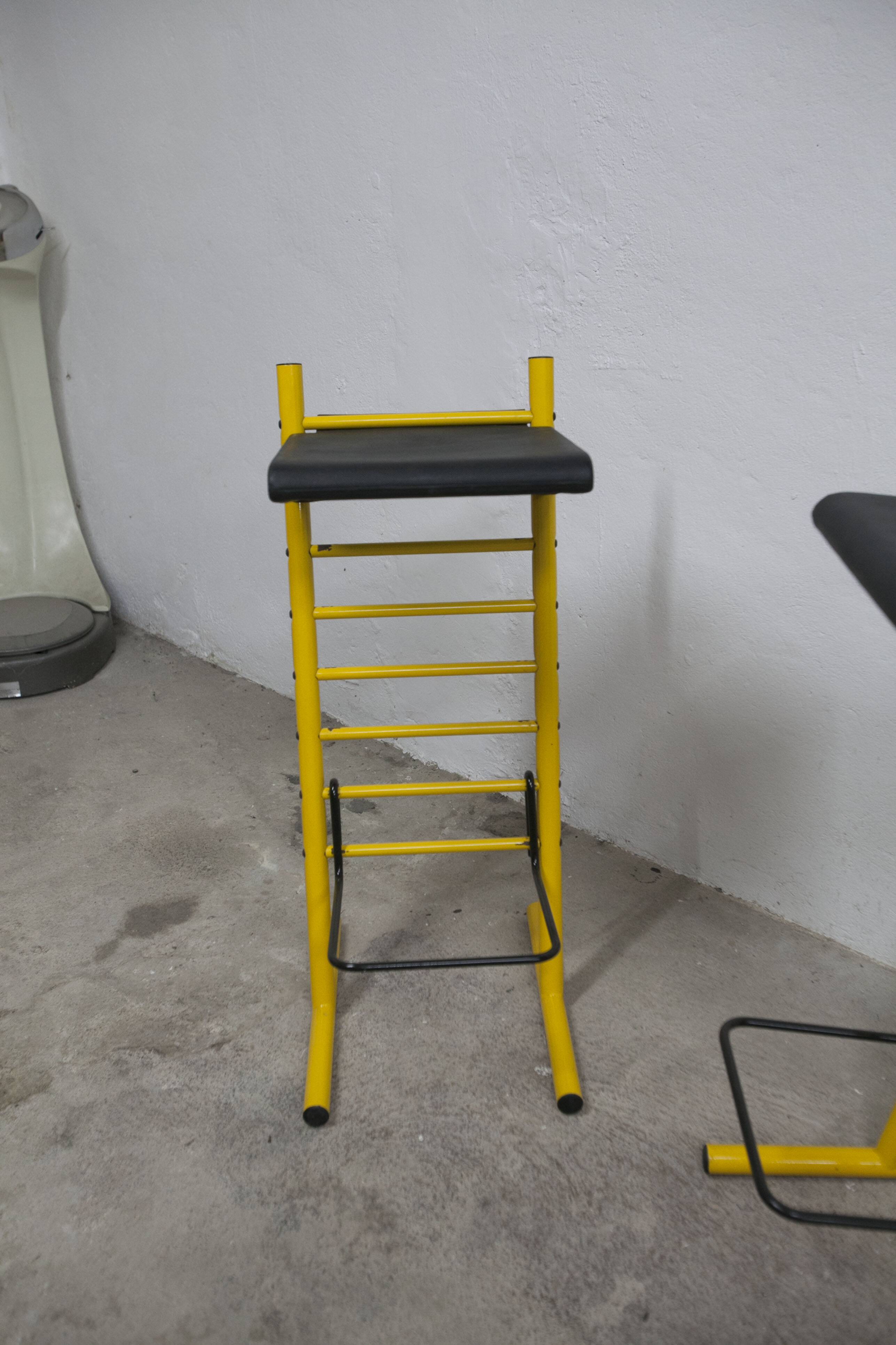 Pair of adjustable Italian bar stools in lacquered yellow and black