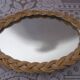 Small oval wicker mirror