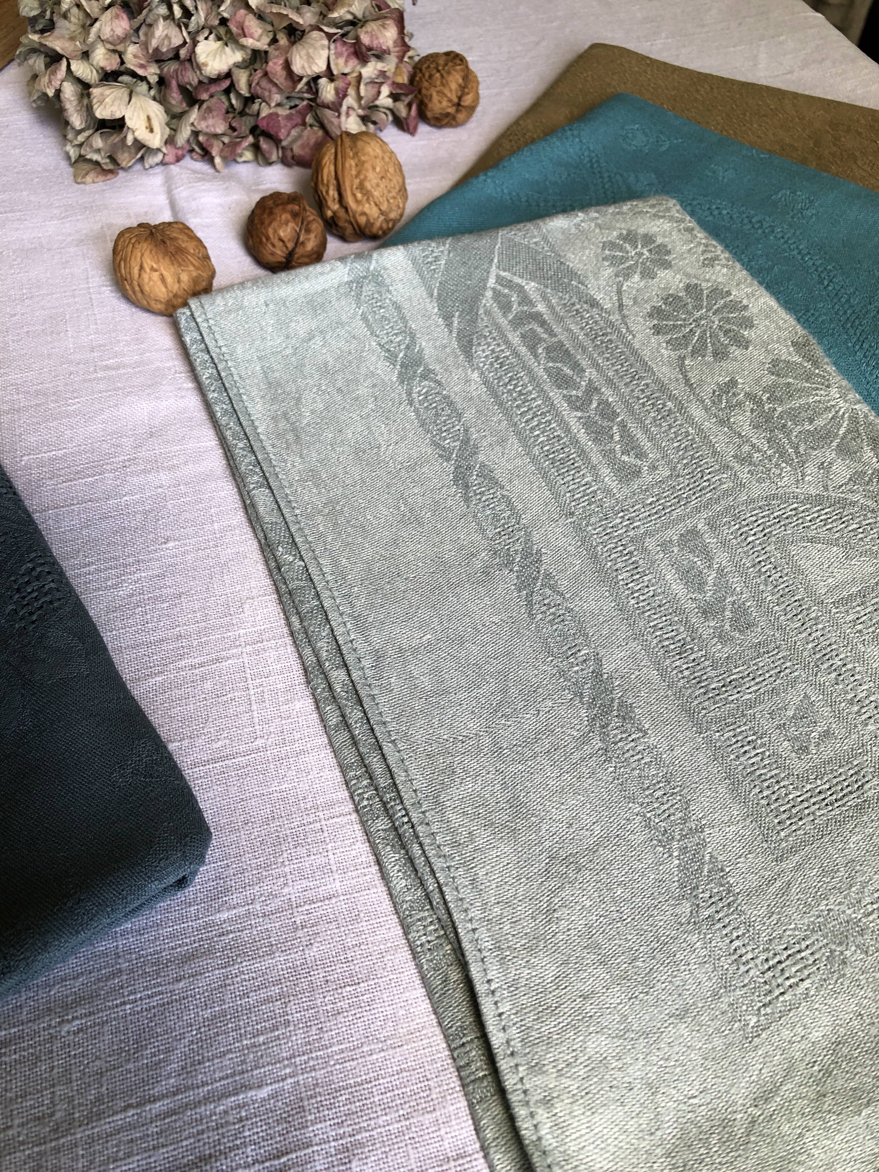 Suite of four tinted antique napkins