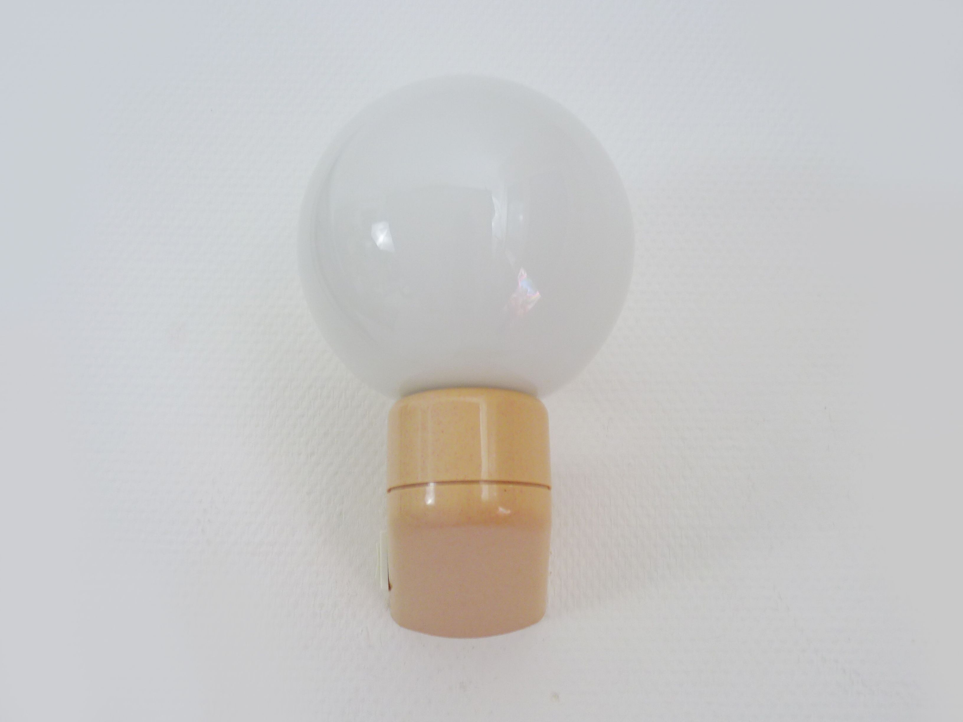 Vintage wall lamp in beige pvc with pink dot and globe in white opaline. Year 70