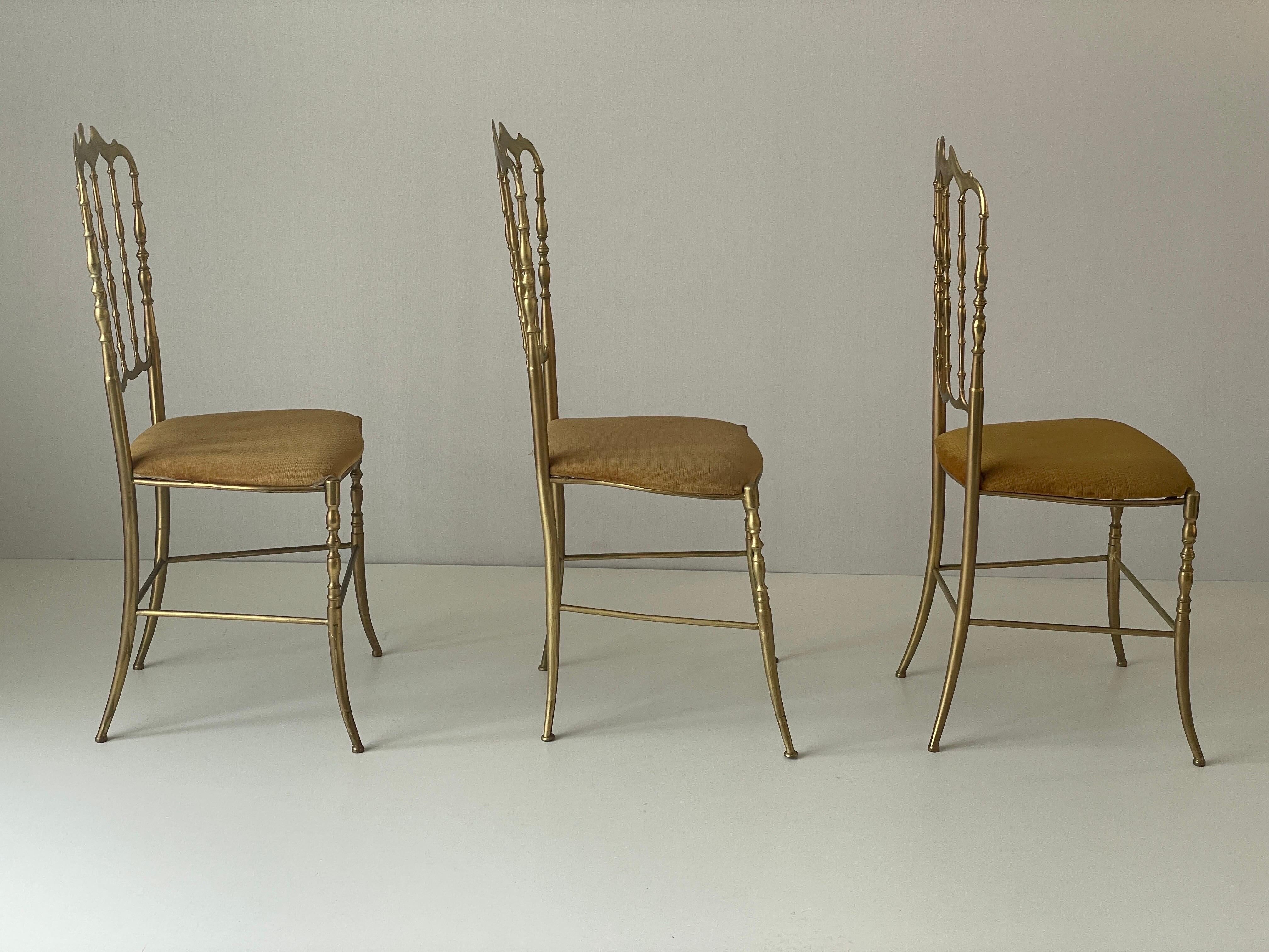 Set of 3 Chiavari chairs in brass with velvet seat and high back, 1950s, Italy.