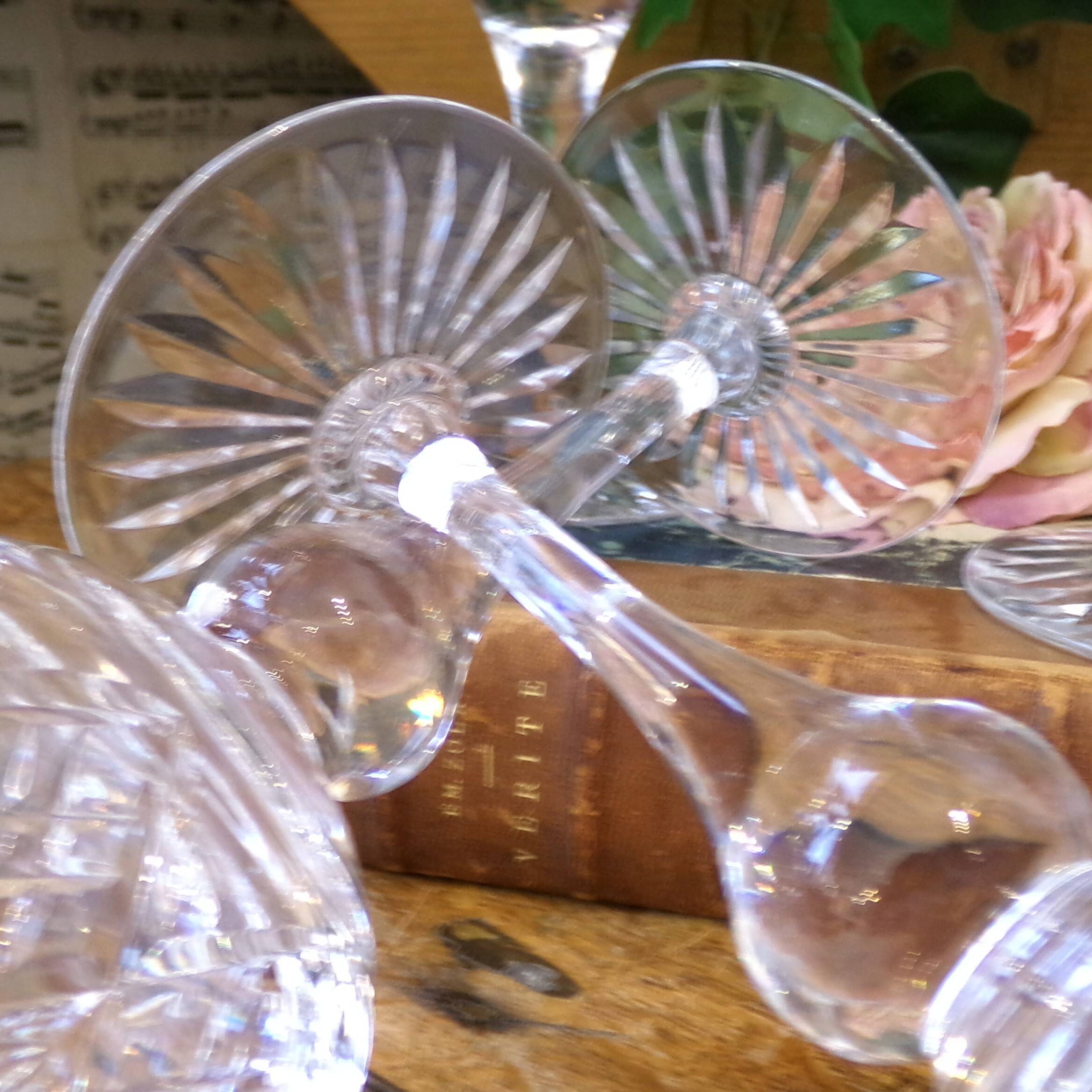 4 lead crystal wine glasses with slender baluster stems.