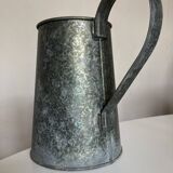 Old garden pitcher vase in folded zinc