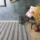 Handwoven vintage geometrical rug, grey background