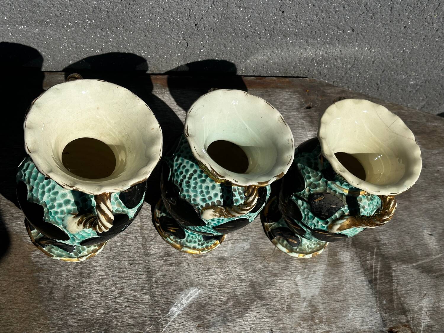 Trio of Vallauris vases in turquoise and black, highlighted with gold, 22 cm high