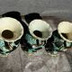 Trio of Vallauris vases in turquoise and black, highlighted with gold, 22 cm high