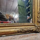 Old nineteenth century mirror in gilded wood and carved around 1850