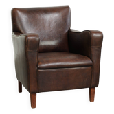 Sturdy vintage sheepskin armchair with a timeless English design
