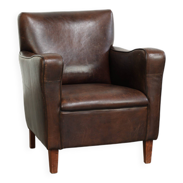 Sturdy vintage sheepskin armchair with a timeless English design