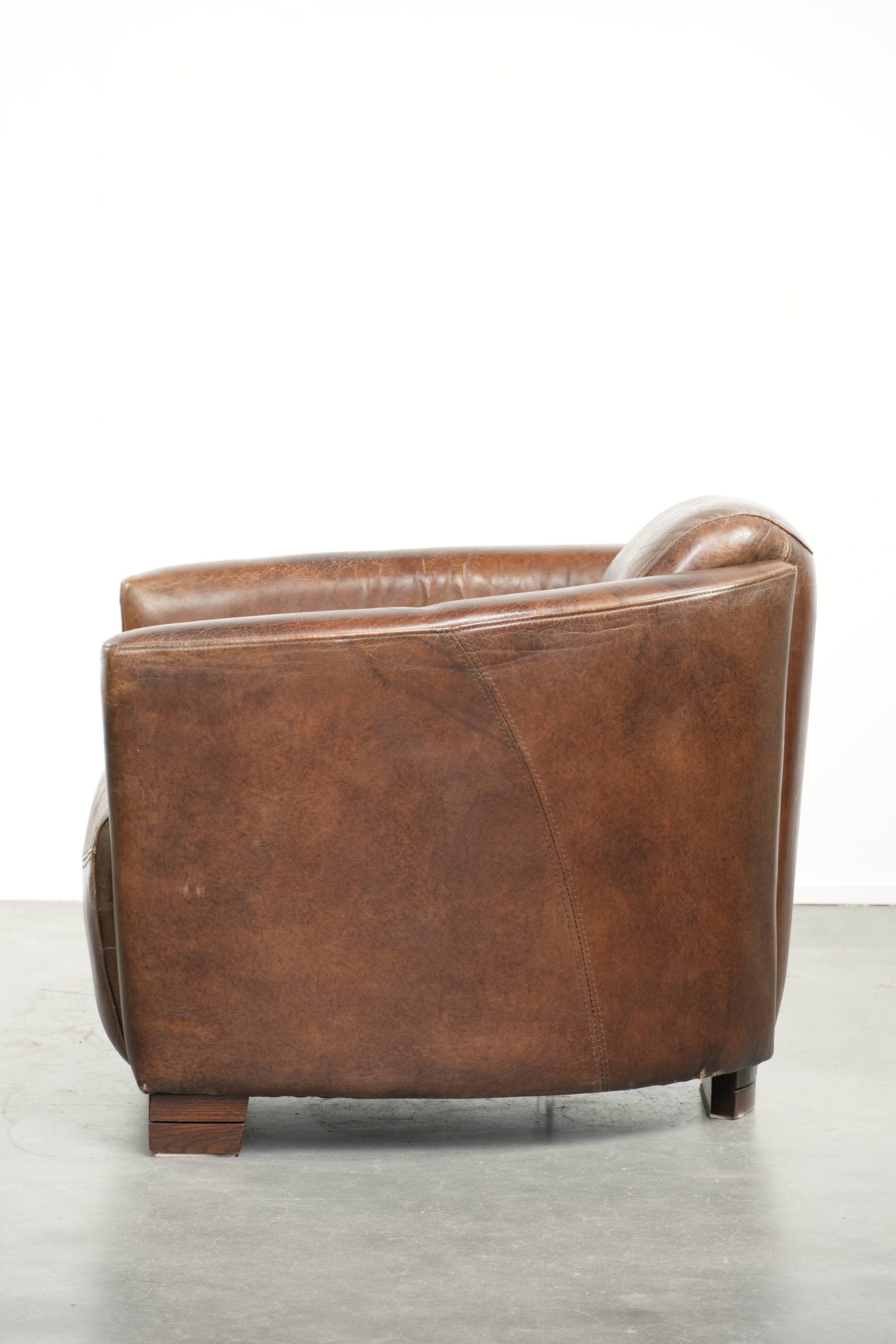 Sturdy dark cognac brown cow leather Aviator design armchair