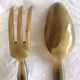 Old corn and silver salad cutlery