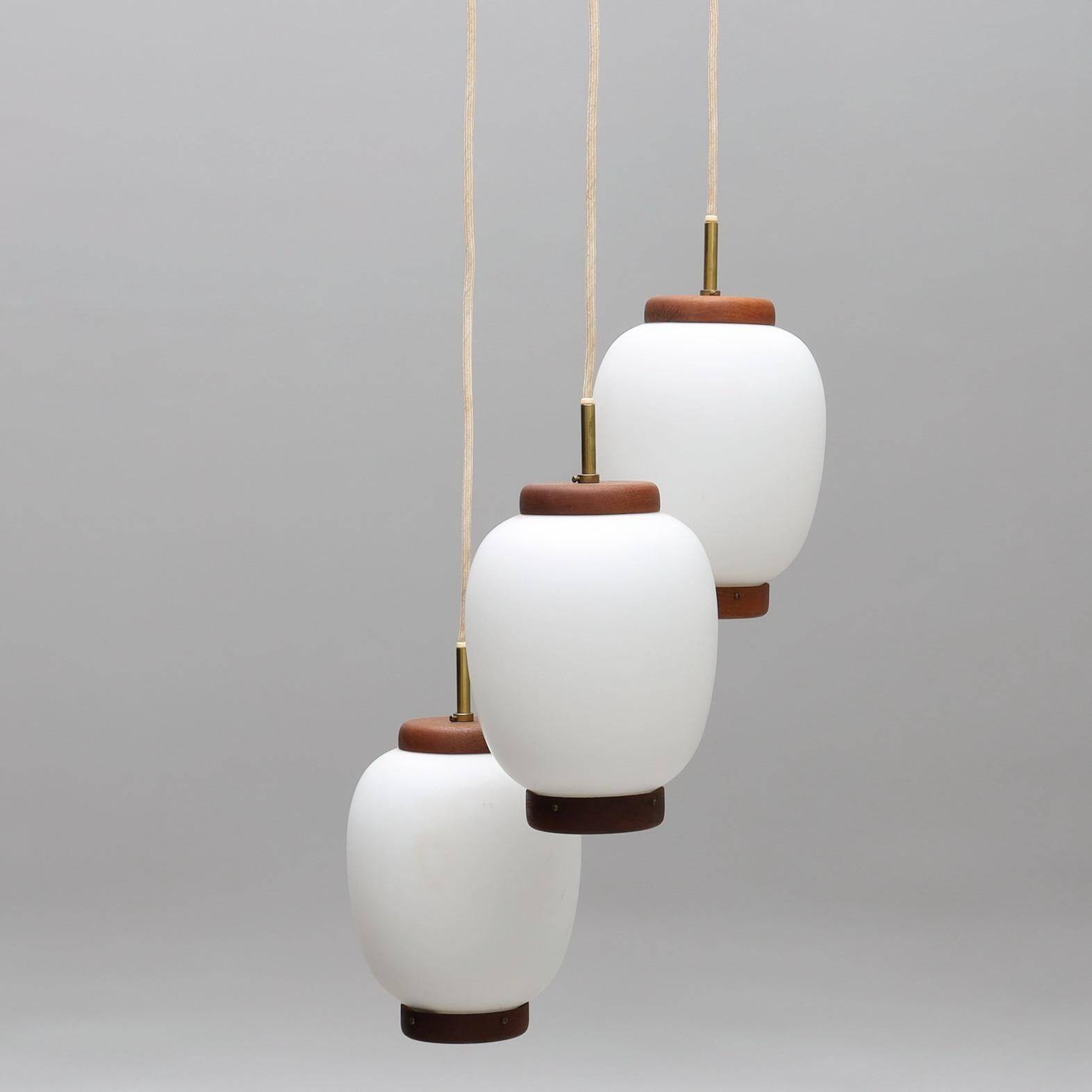 Bent Karlby "China" pendant lights, 3 lights, teak and glass, Lyfa, Denmark, 1960.
