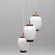 Bent Karlby "China" pendant lights, 3 lights, teak and glass, Lyfa, Denmark, 1960.
