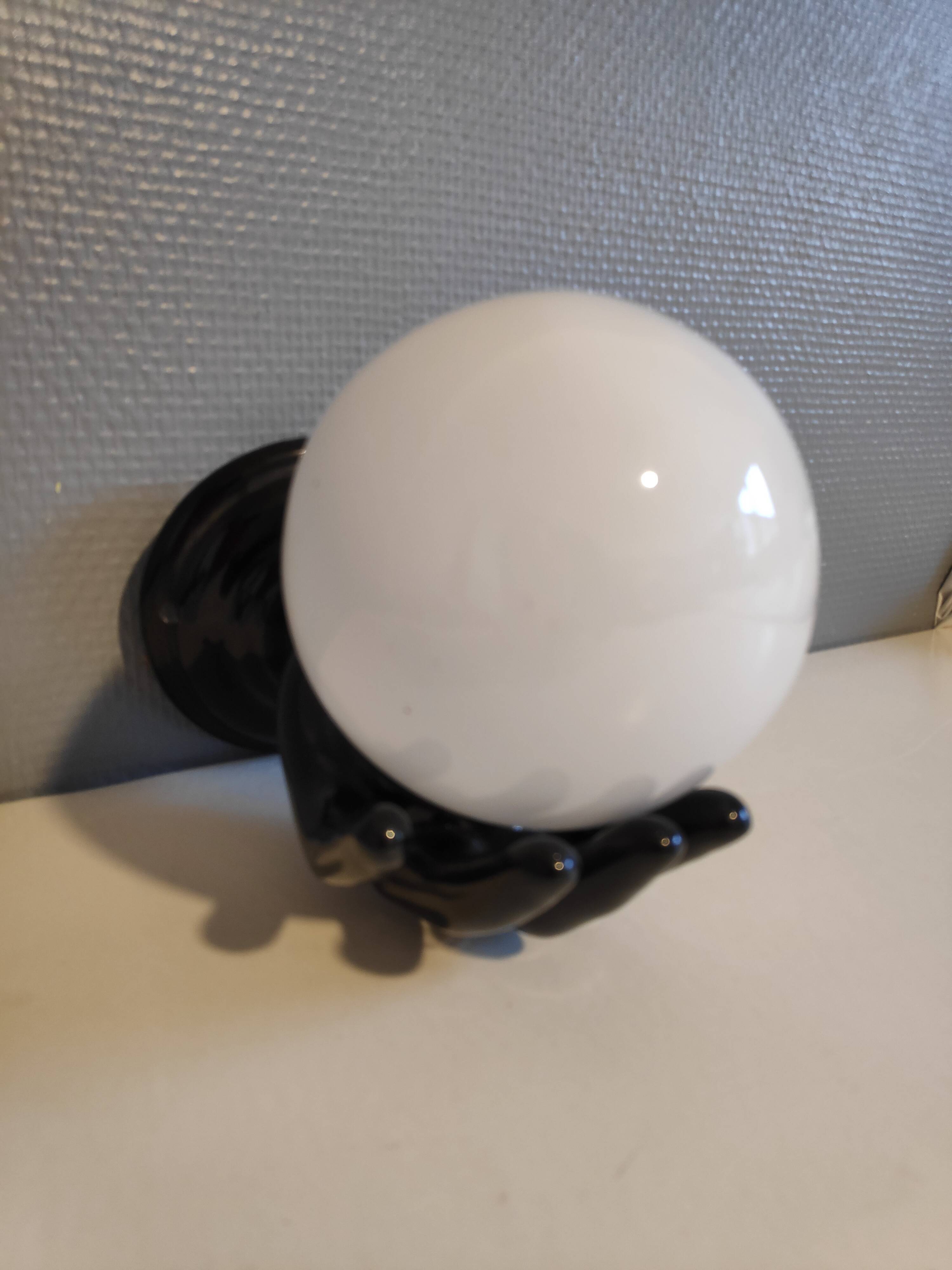 Black ceramic handand white opaline ball sconce