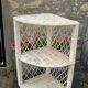 Corner shelf in rattan and vintage white wicker