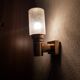 Brass applique with 1970 glass lampshade