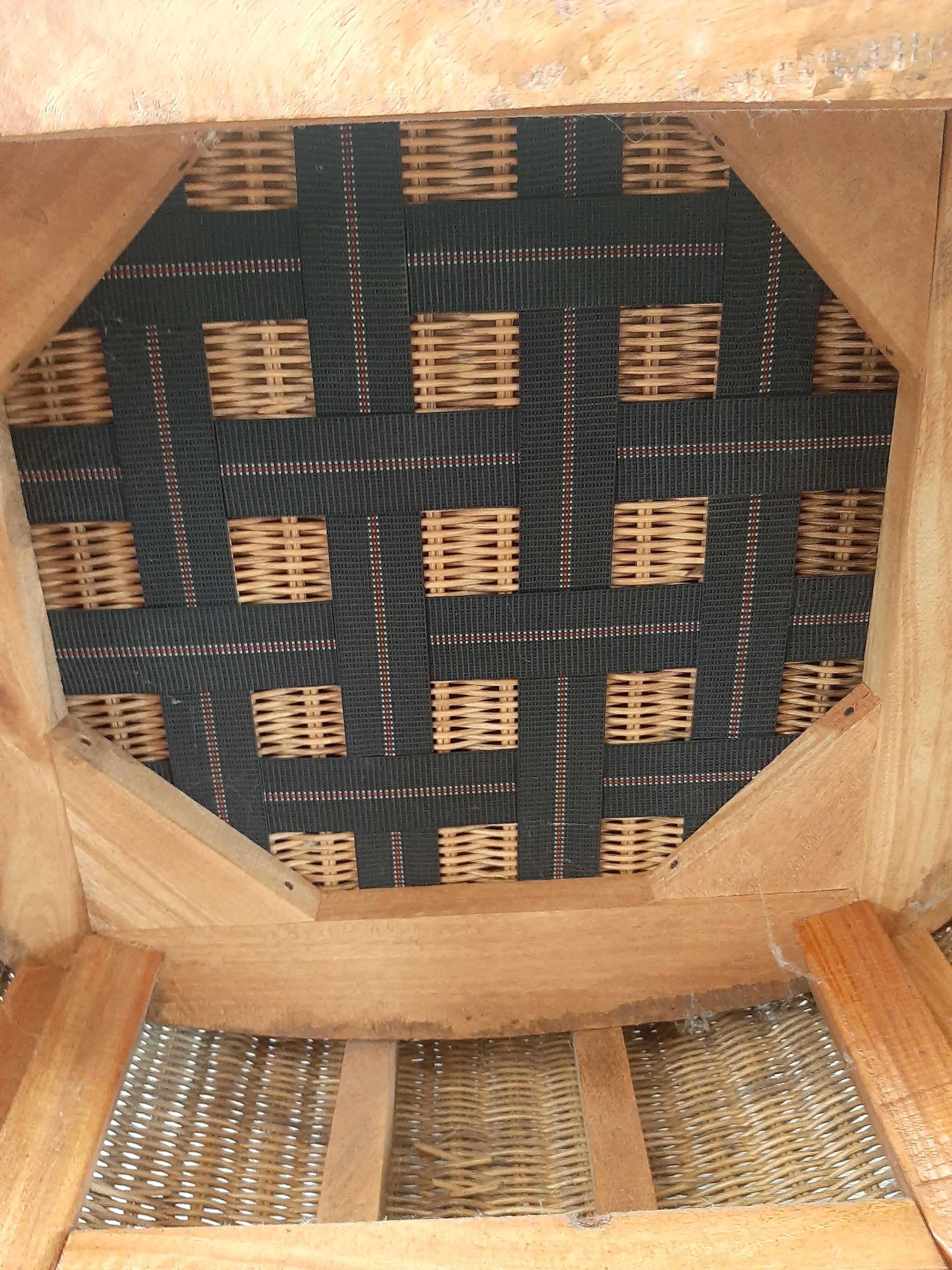 Armchair in woven rattan and exotic wood