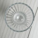 Antique thick glass vase on a pedestal.