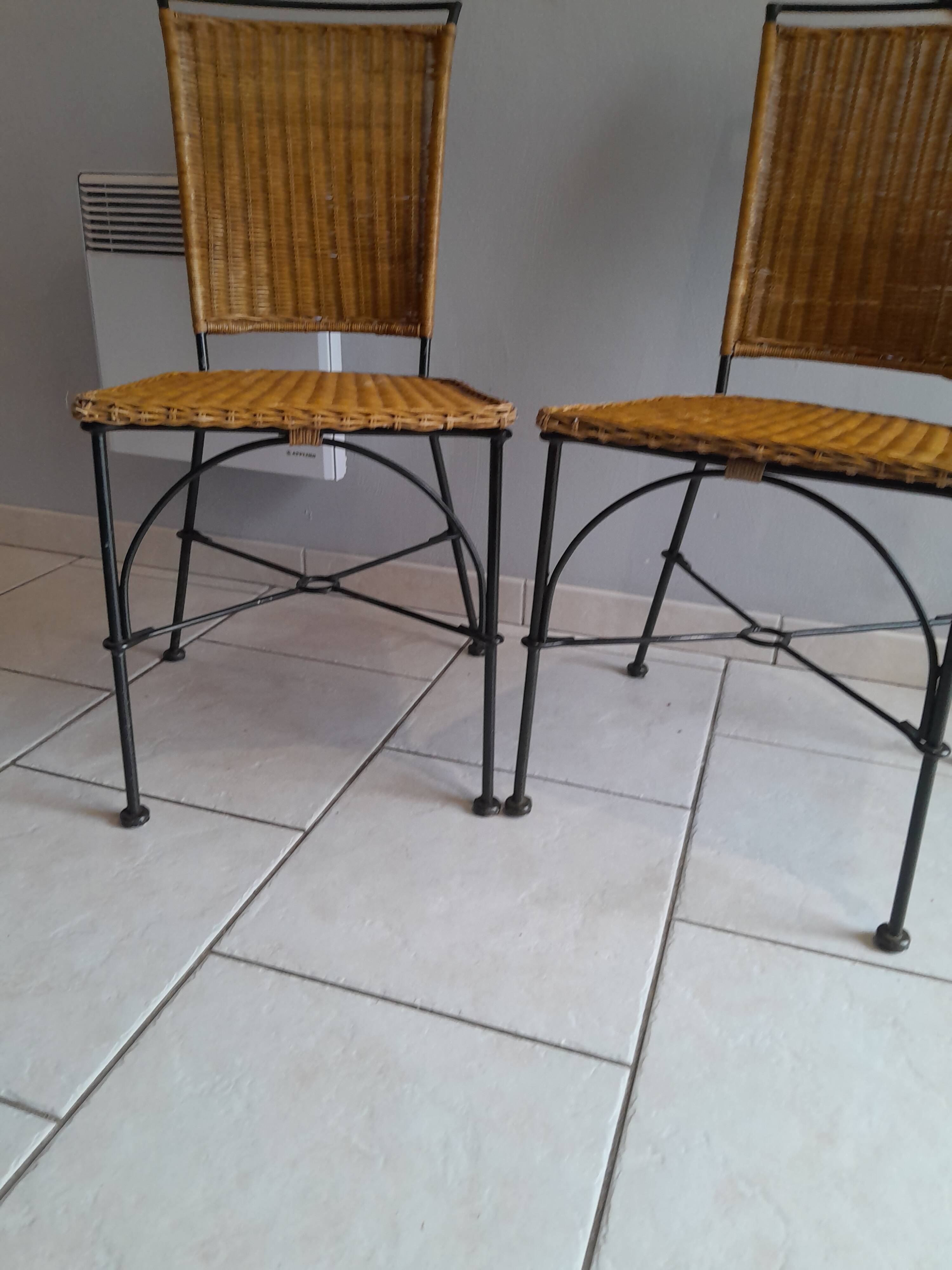 Pair of vintage wrought iron and rattan chairs