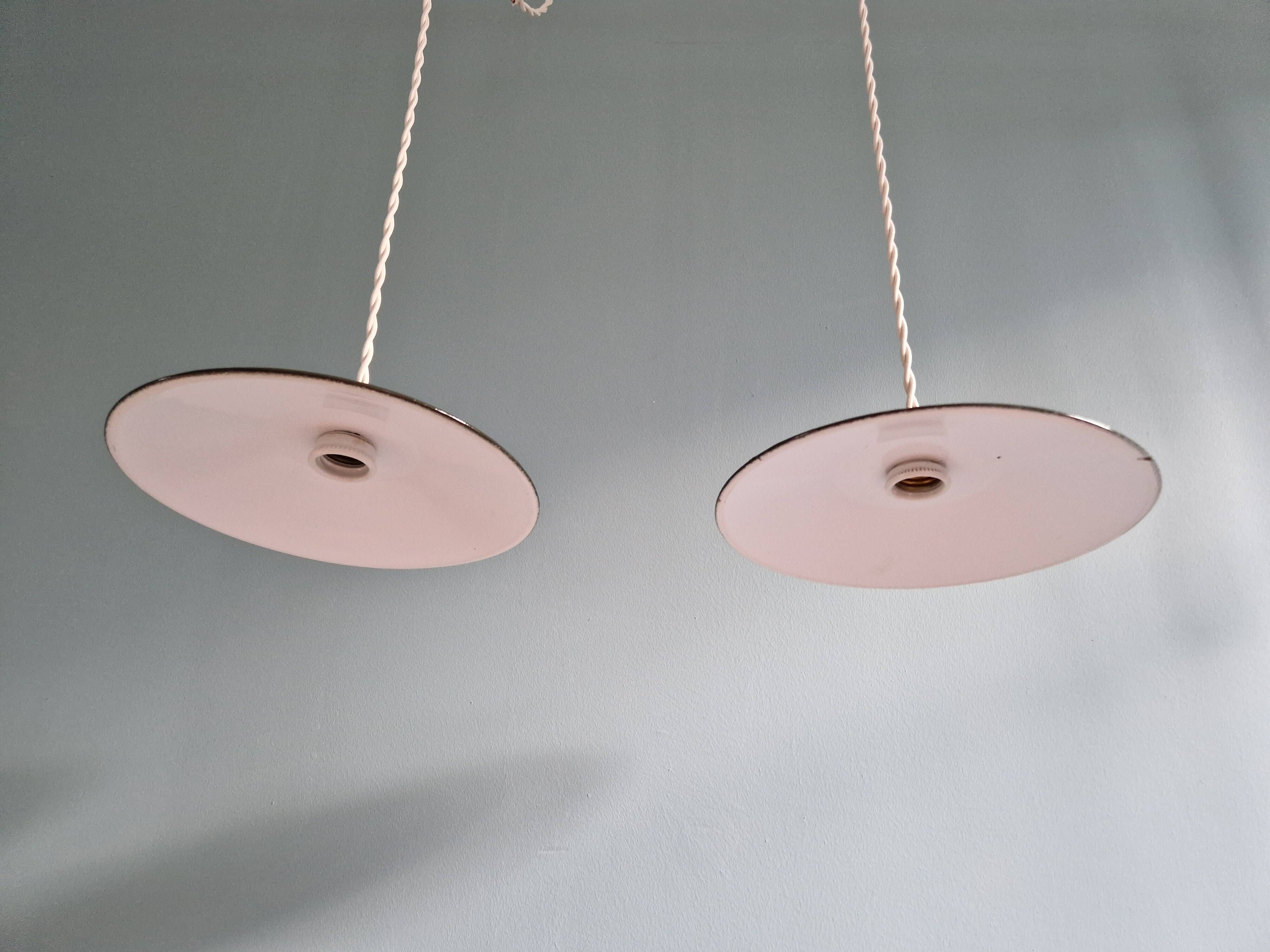 Pair of industrial pendant lights in olive green enameled sheet metal