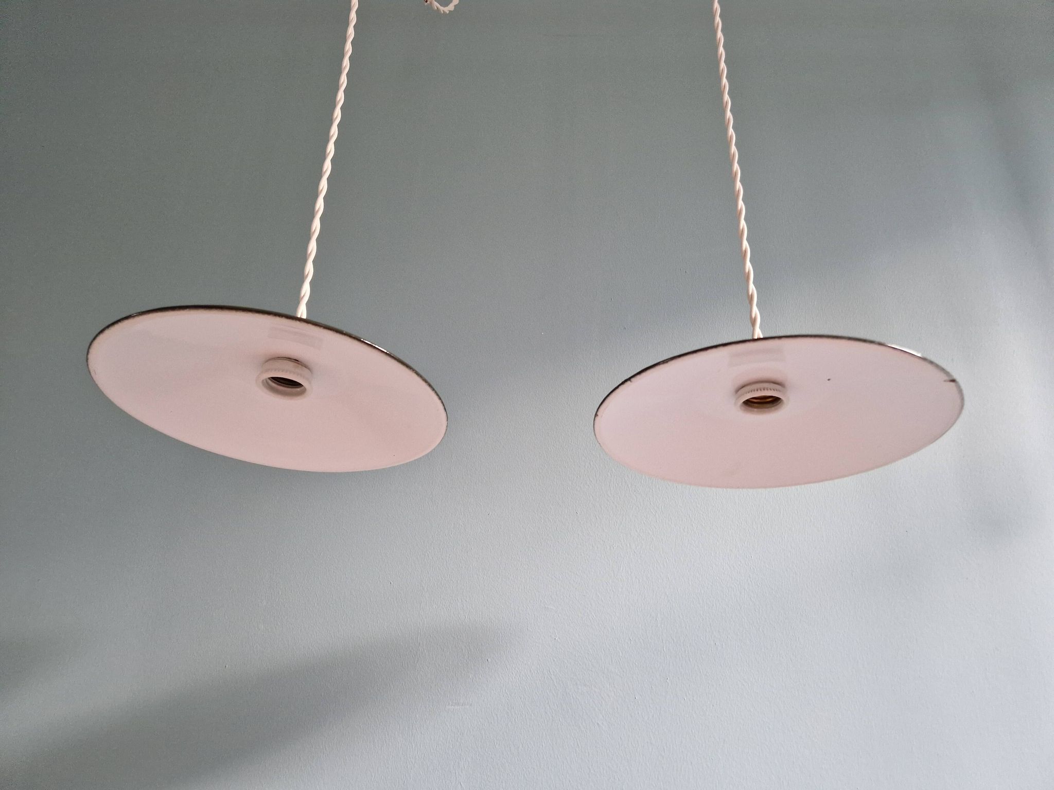 Pair of industrial pendant lights in olive green enameled sheet metal