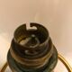 Brass lamp with removable ring around a globe