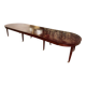 Directoire period extendable dining table in mahogany with a band.