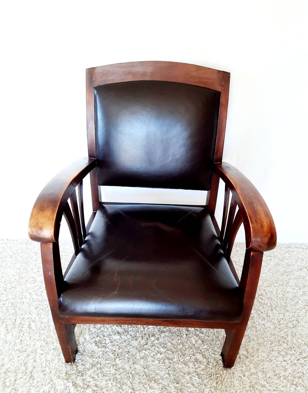 Colonial style wooden armchair