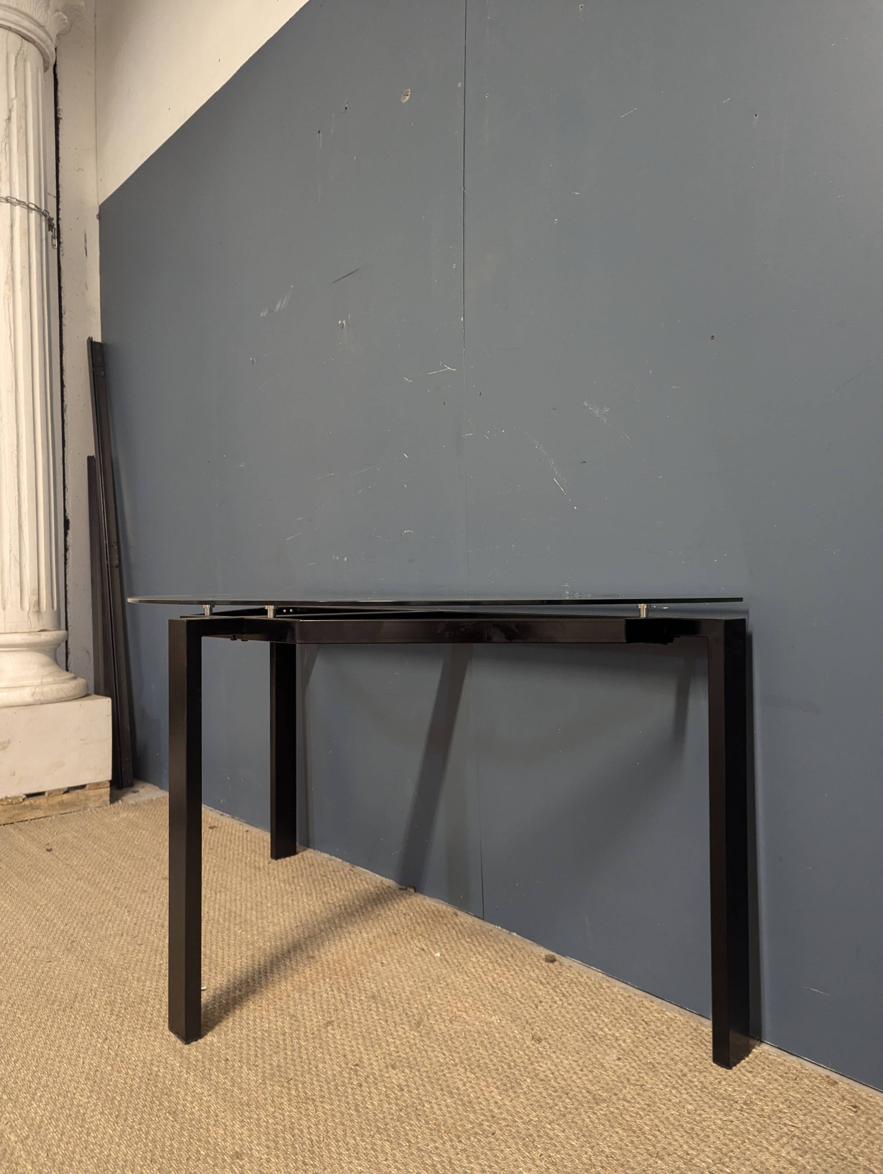 Black metal console with glass top