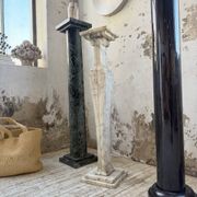 Set of 4 marble columns or pedestals.