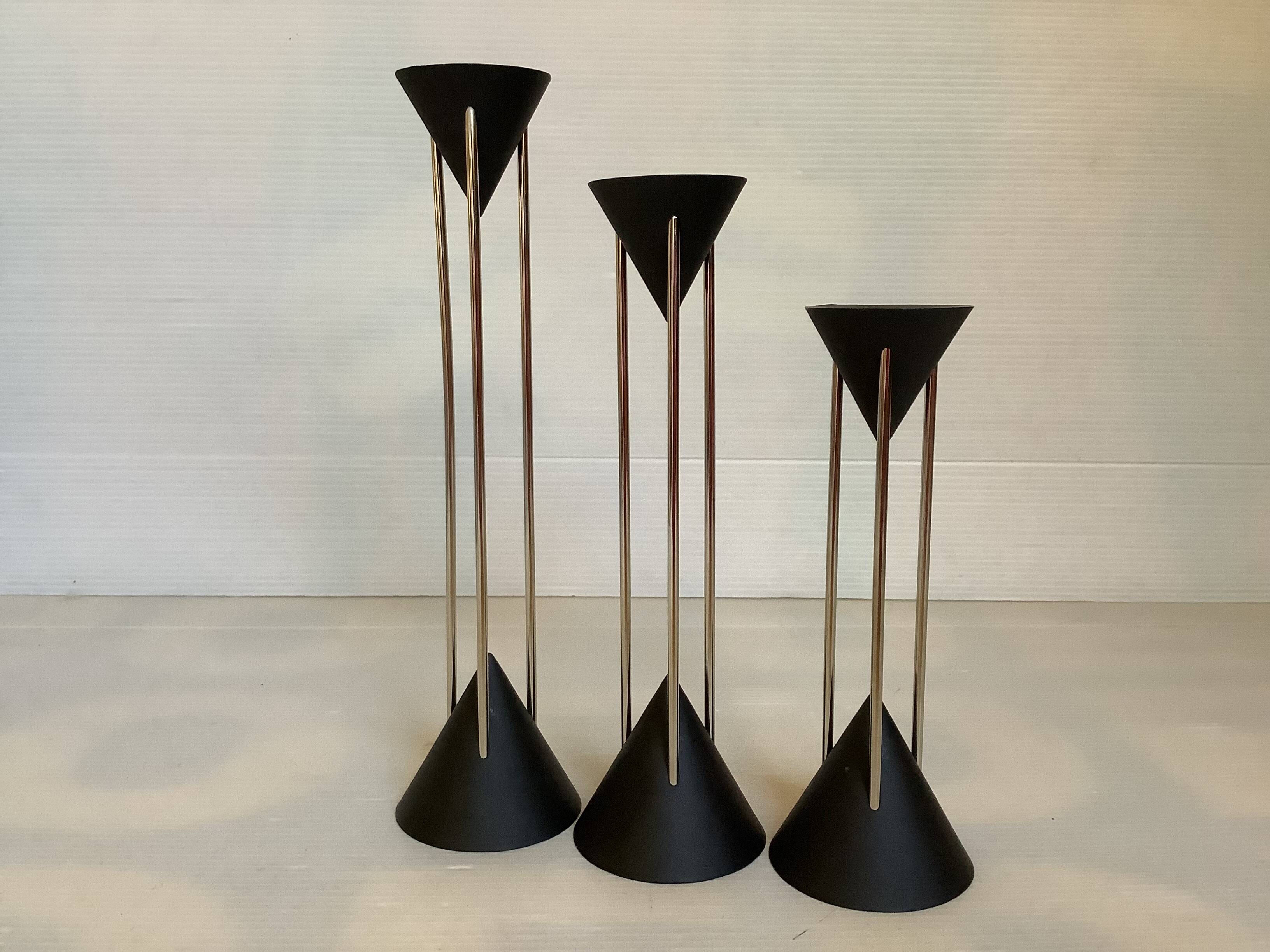 Vintage black candlestick trio