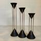Vintage black candlestick trio