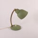 Flexible brass and green metal bedside lamp, 1950s.