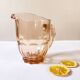 Pitcher and 6 water glasses in pink glass