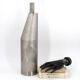 Stainless steel bottle in the style of Philolaos Tloupas.