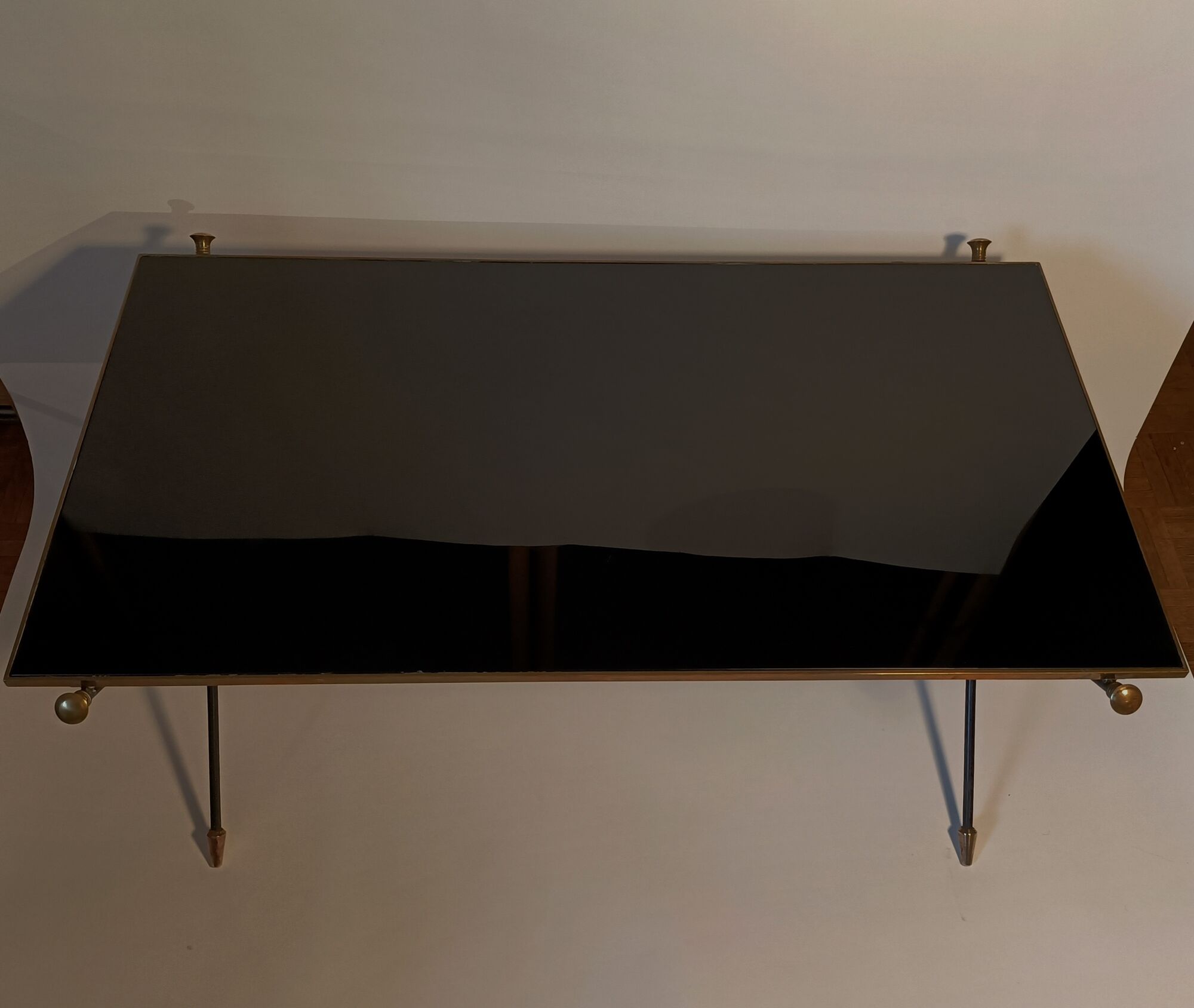 Coffee table in gilded brass, black metal and black opaline top, circa 1950