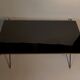Coffee table in gilded brass, black metal and black opaline top, circa 1950