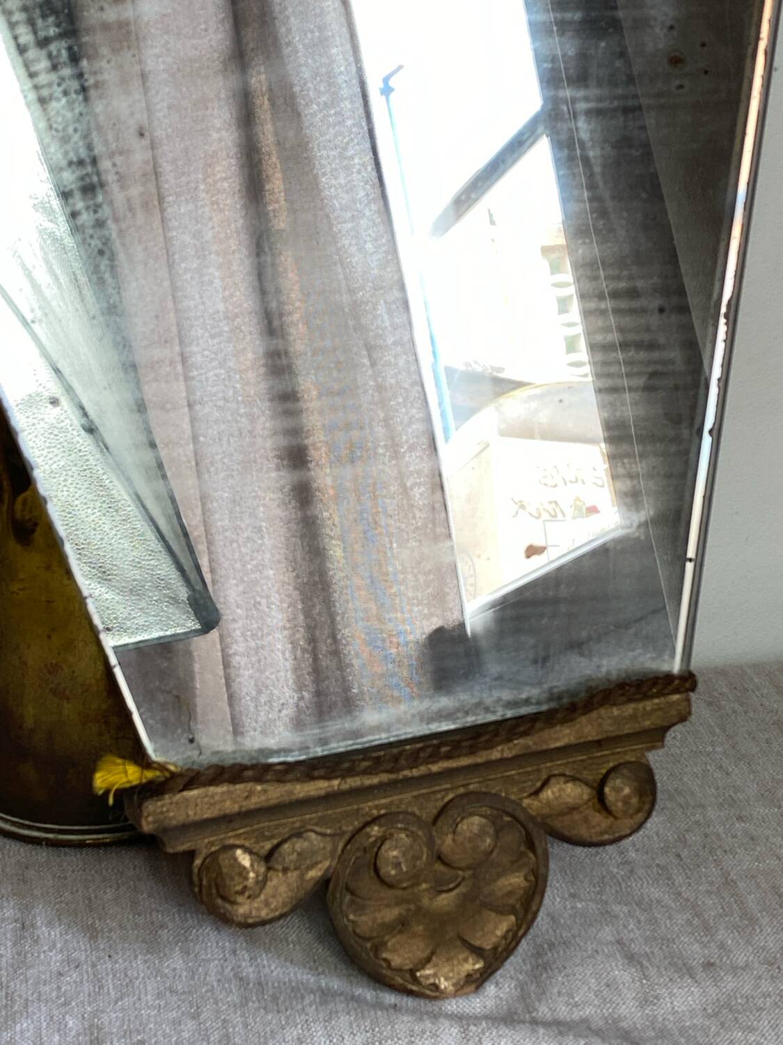 Antique wooden mirror with an unusual shape