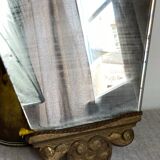 Antique wooden mirror with an unusual shape