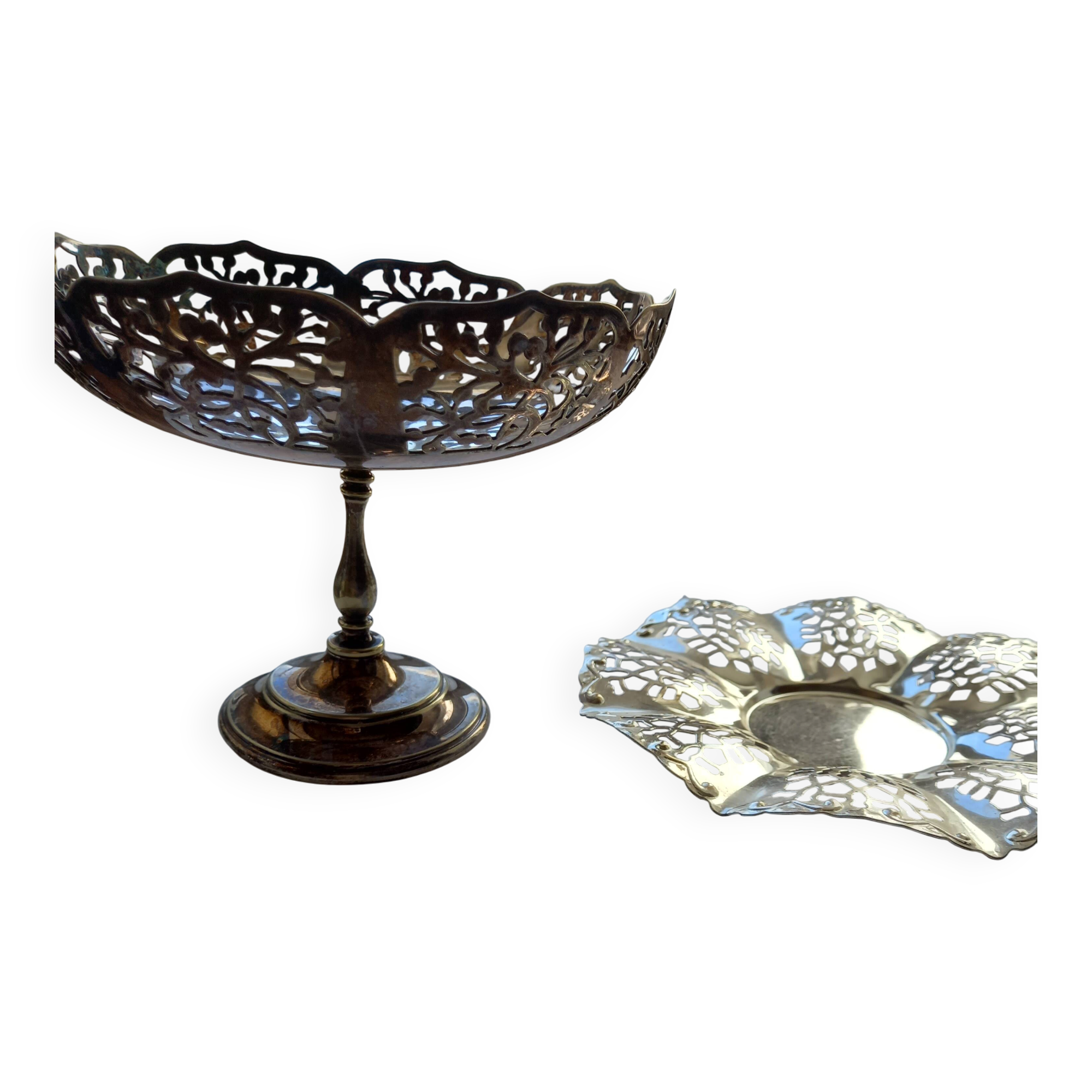 Two metal cups with an openwork design.