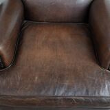 Set of two characterful sheepskin armchairs with a beautiful deep colour