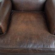 Set of two characterful sheepskin armchairs with a beautiful deep colour