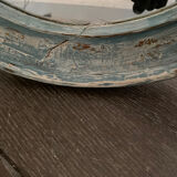 Patinated oval mirror