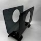 Vintage 1970s smoked plexiglass magazine rack, minimalist design.