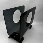 Vintage 1970s smoked plexiglass magazine rack, minimalist design.