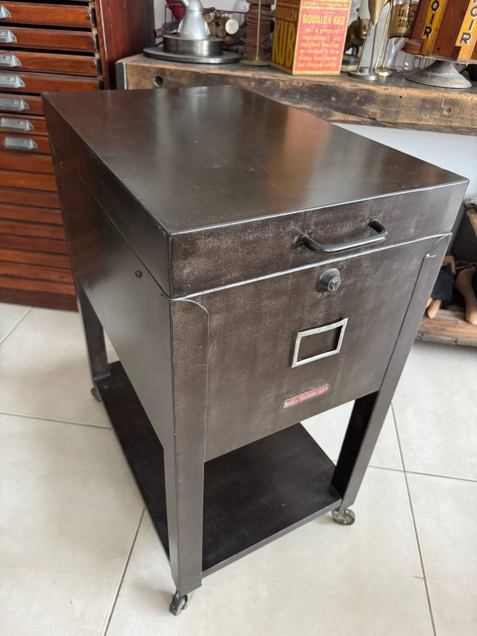 Vintage industrial filing cabinet on wheels