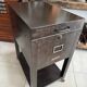 Vintage industrial filing cabinet on wheels