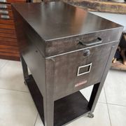 Vintage industrial filing cabinet on wheels