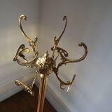 Turning brass coat rack